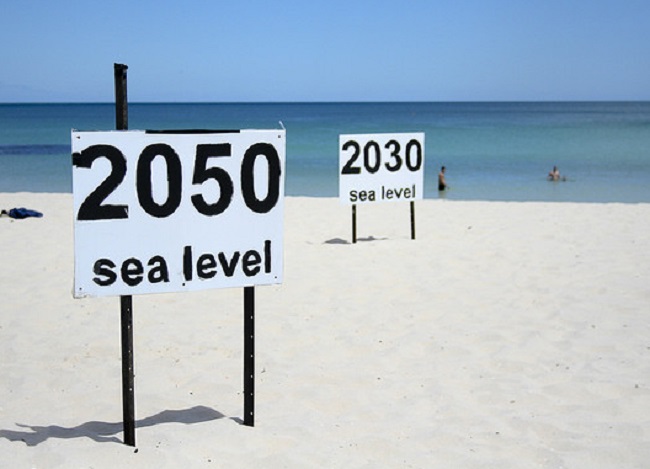 Signs predicting sea level rise at Cottesloe Beach in Perth, Australia. Image credit - Julie G 