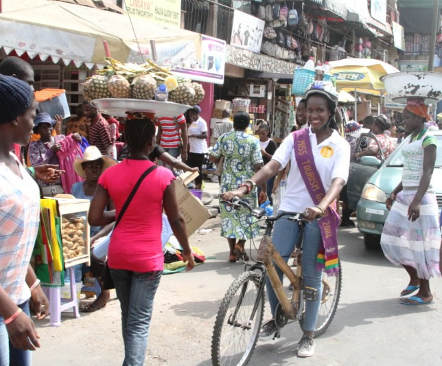 Naa Teidey Ofori, Miss Tourism Ghana  riding bamboo bicycles to mark #IWD2015