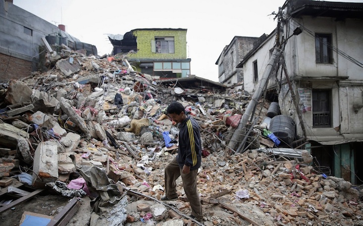 A man surveying the rubble on Sunday, a day after a massive earthquake struck near Katmandu, Nepal. (PHOTO: Narendra Shrestha:EPA)
