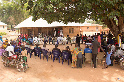 a meeting at the Okobo community
