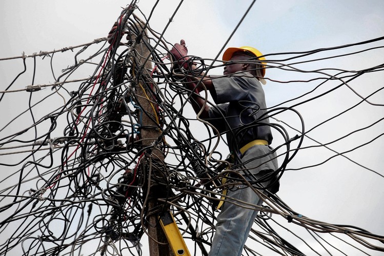 Power distribution lines for both metered and unmetered consumers in Nigeria (PHOTO: sweetcrudereports)