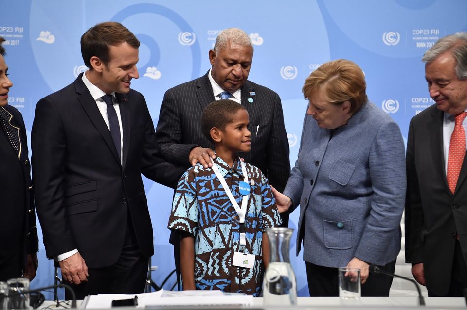 French President, Fijian Prime Minister, German Chancellor and and hte young boy from Fiji