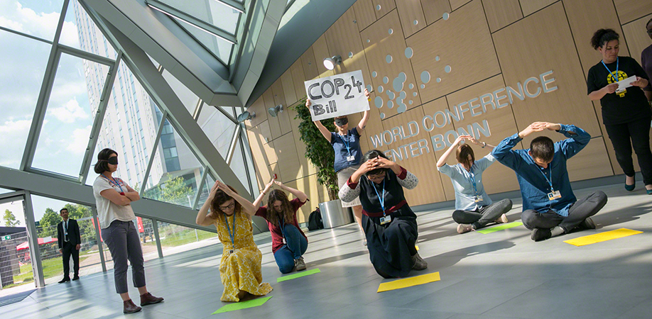 Members of civil society hold a demonstration to stress the importance of human rights and the role of civil society in the fight against climate change.