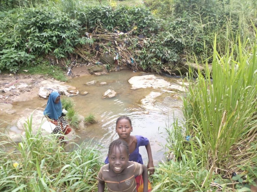 Children playing in the stream