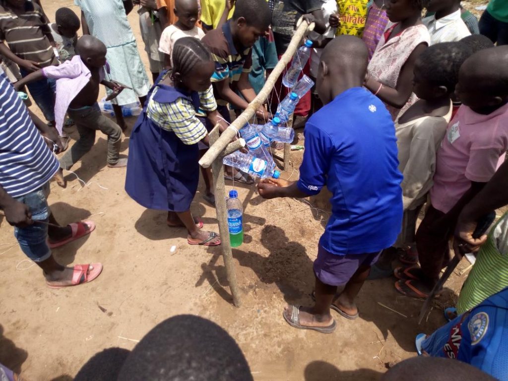 Chiamaka leading other pupils in handwashing