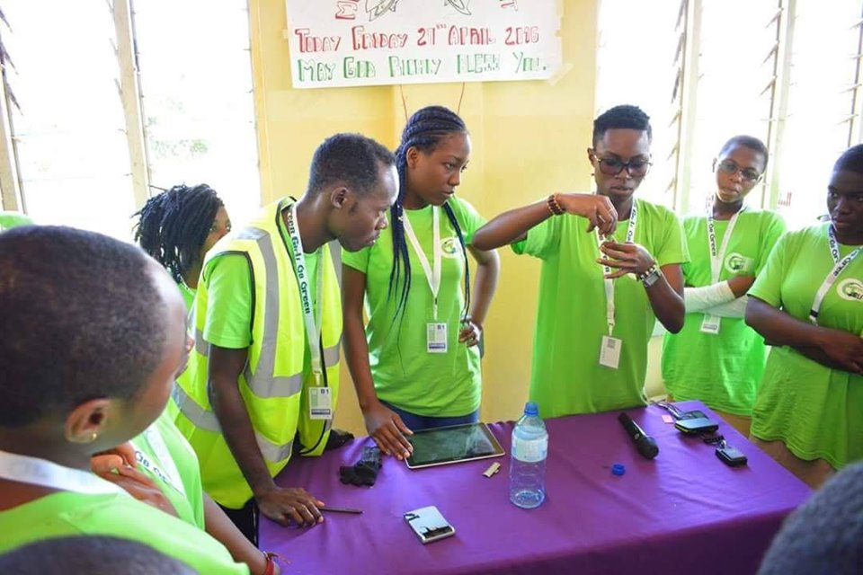 Monique Ntumngia demonstrating how solar energy is obtained using waste